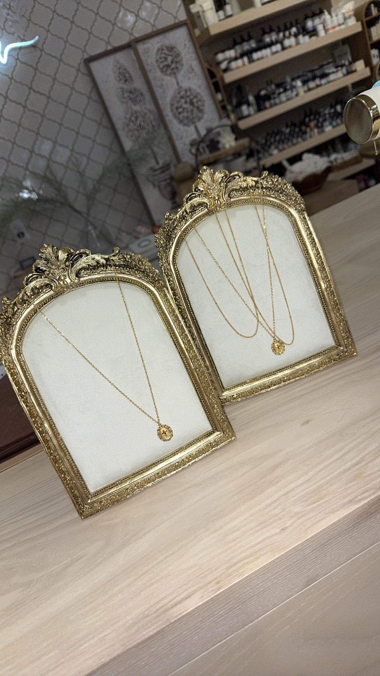 arched gold jewelry display frame