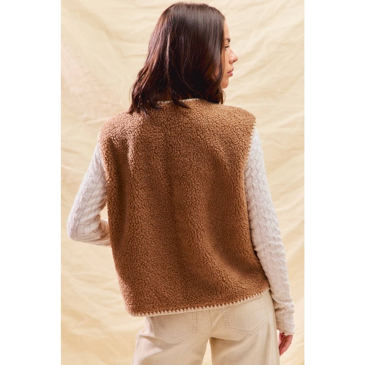 sherpa vest with stitch detail + front pockets
