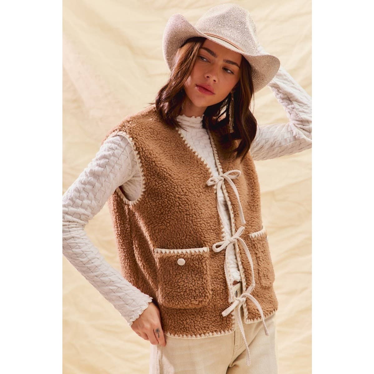 sherpa vest with stitch detail + front pockets