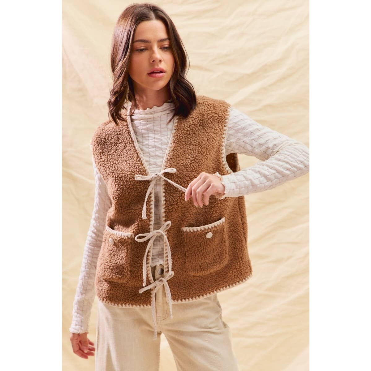 sherpa vest with stitch detail + front pockets