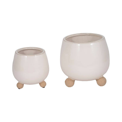 ivory round planter with knobby feet