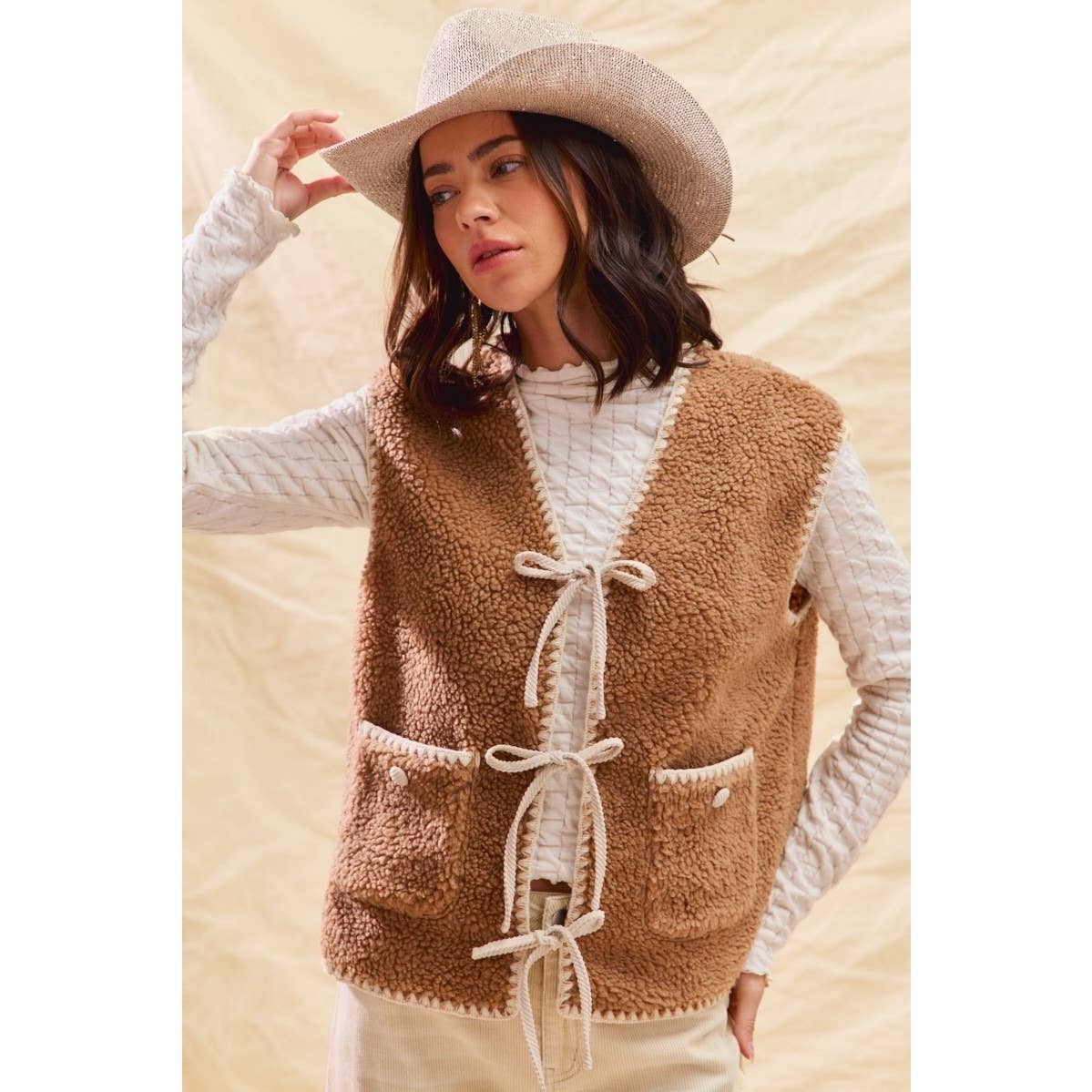 sherpa vest with stitch detail + front pockets