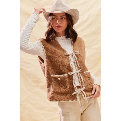 sherpa vest with stitch detail + front pockets