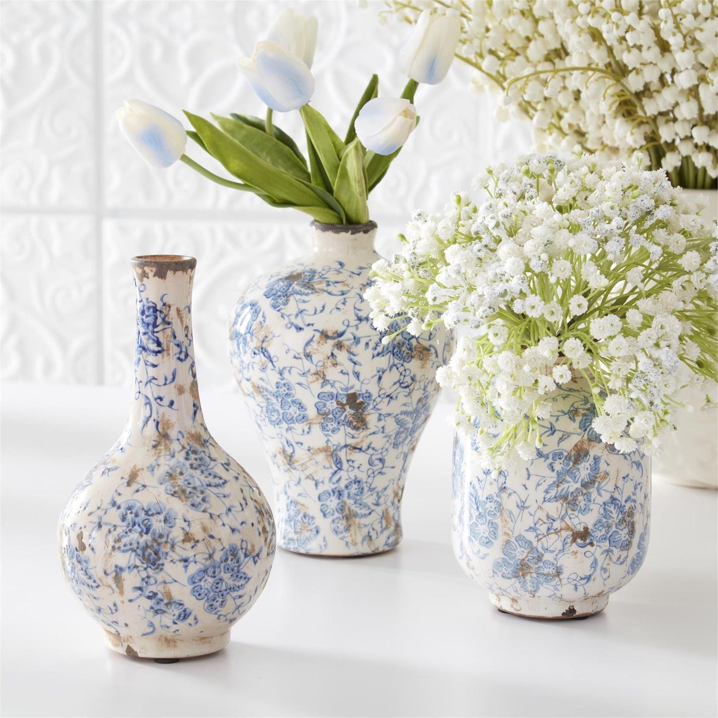 blue + white ceramic bud vases