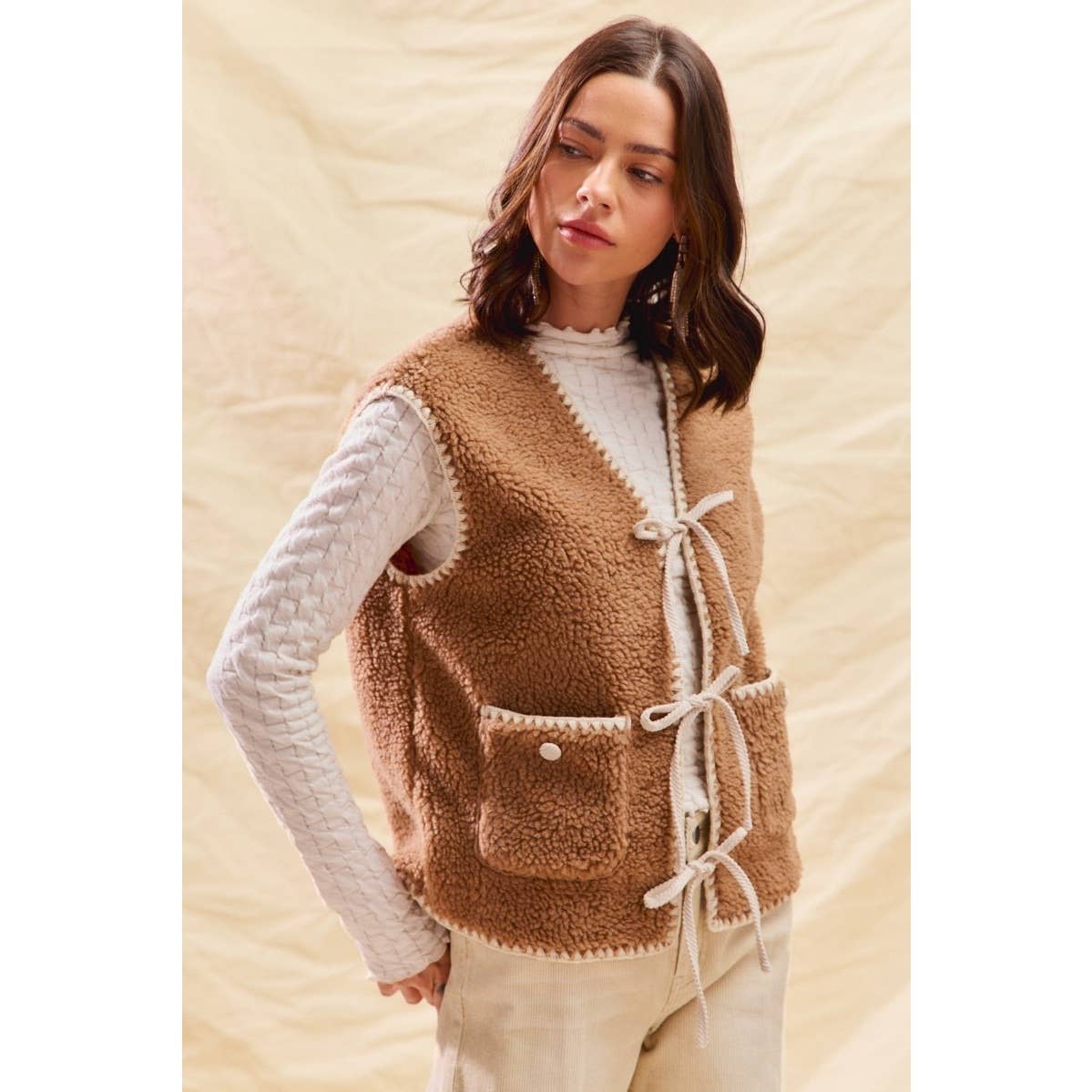 sherpa vest with stitch detail + front pockets
