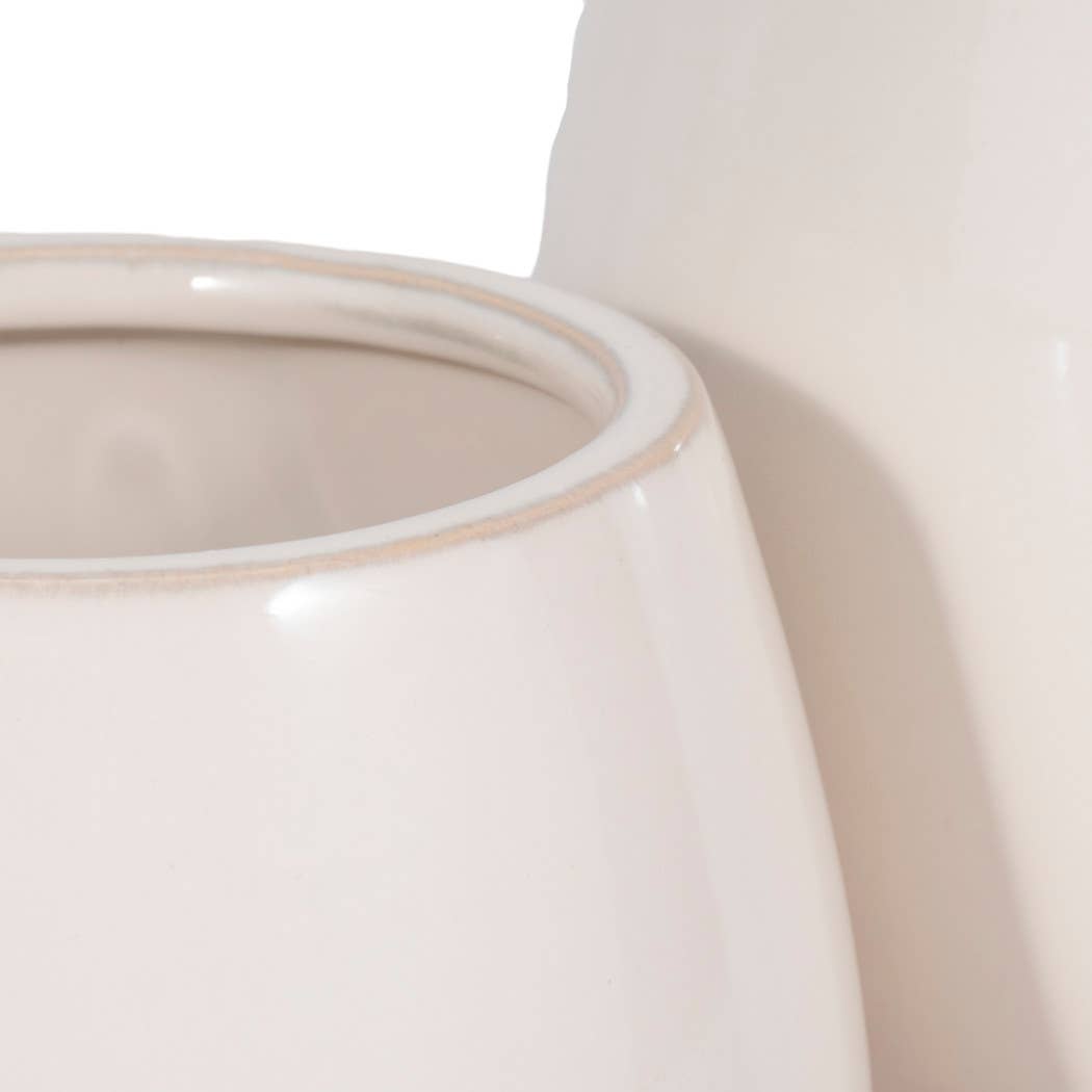 ivory round planter with knobby feet