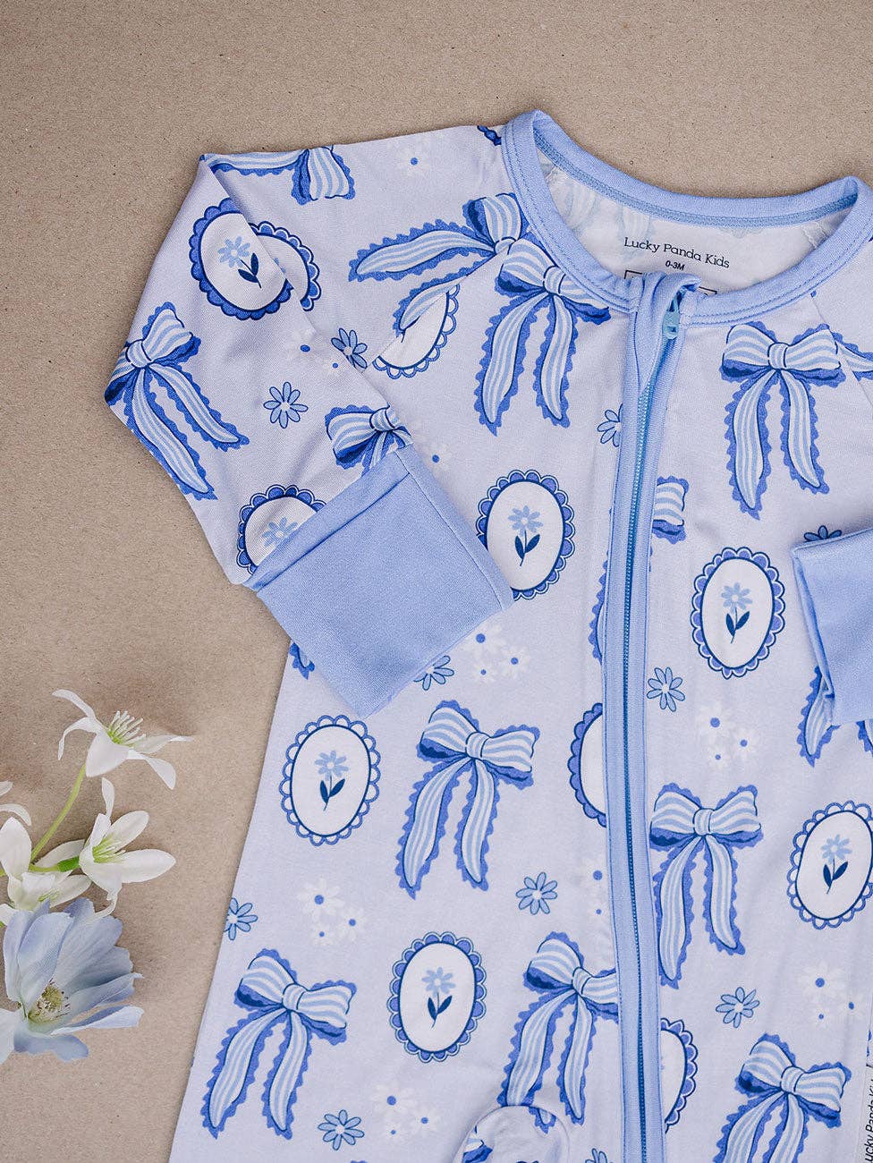 blue bow bamboo zip romper
