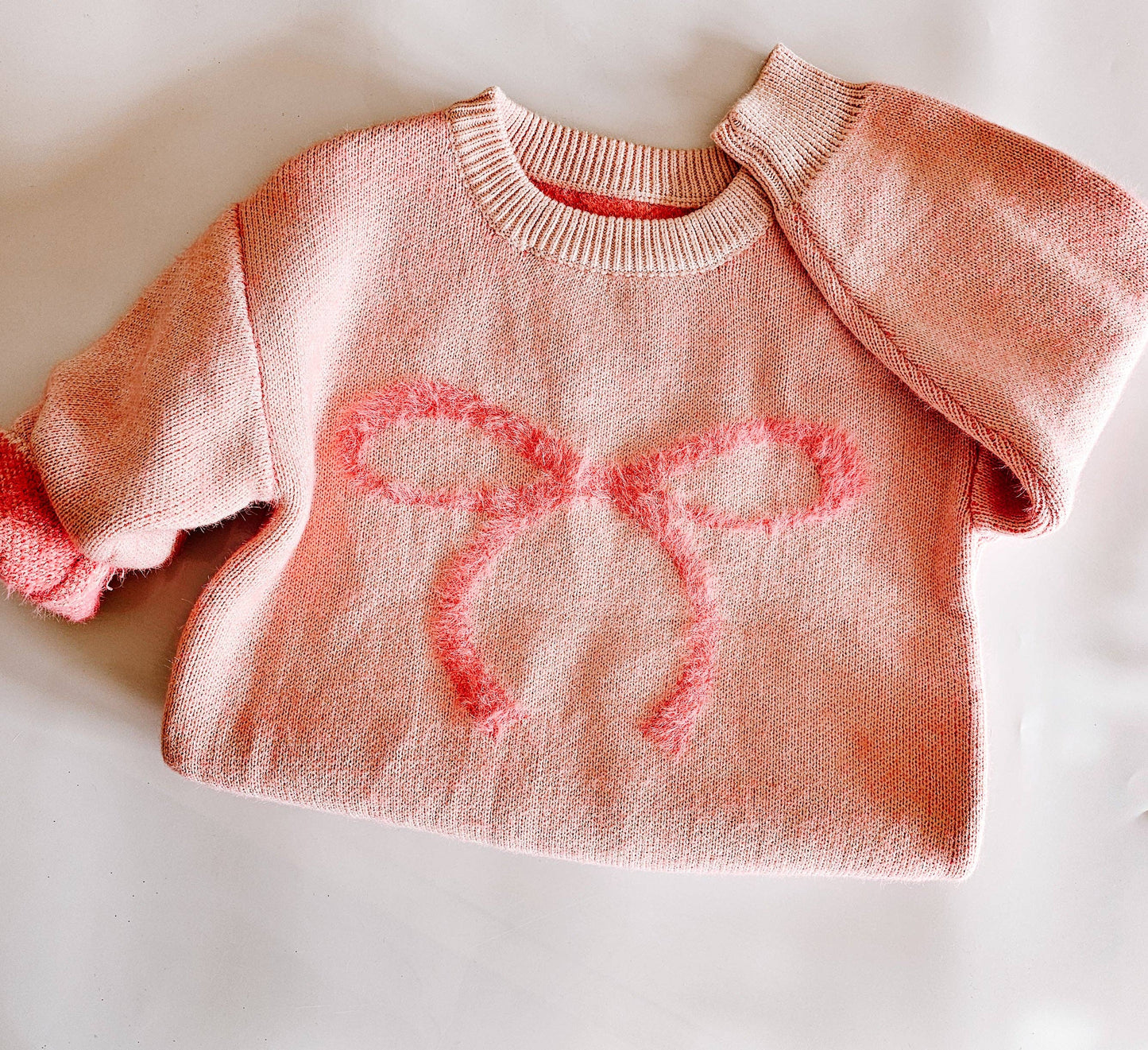 fuzzy bow sweater
