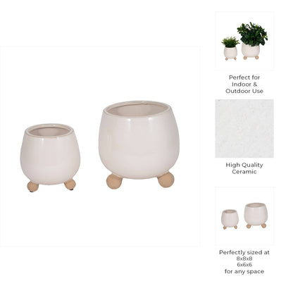 ivory round planter with knobby feet
