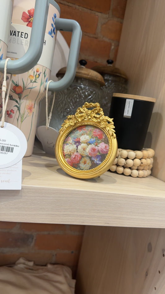 golden bow oval frame w/ floral photo
