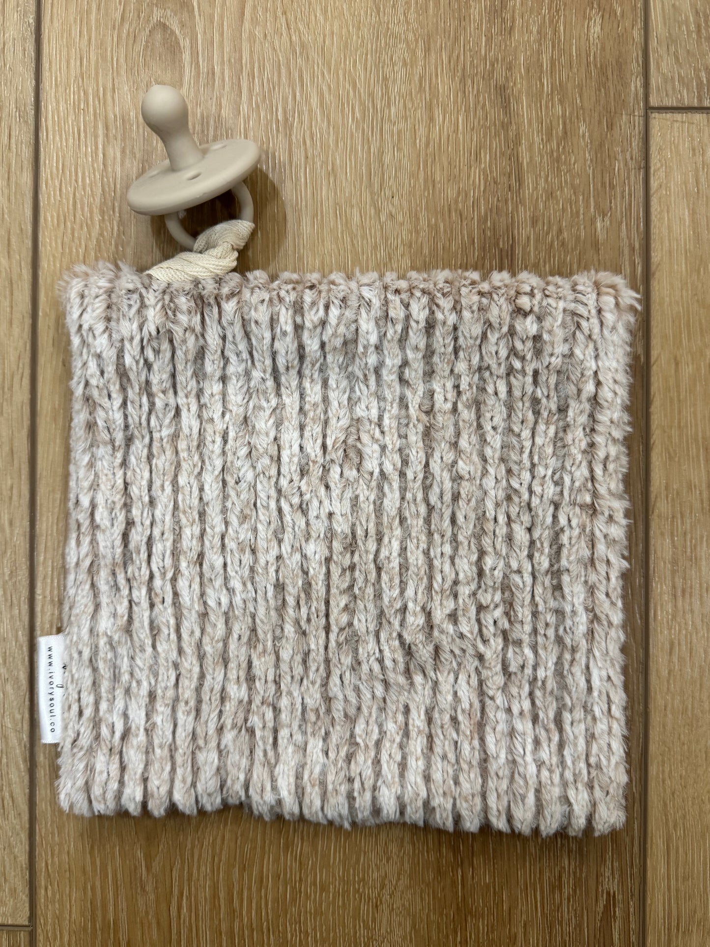 black + white daisy check pacifier blanket