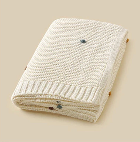 knit colored pom baby blanket • cream