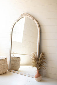 arched wood framed mirror