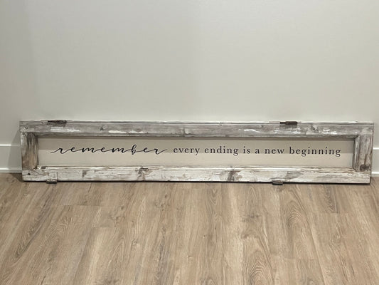 handcrafted "remember every ending is a new beginning" sign