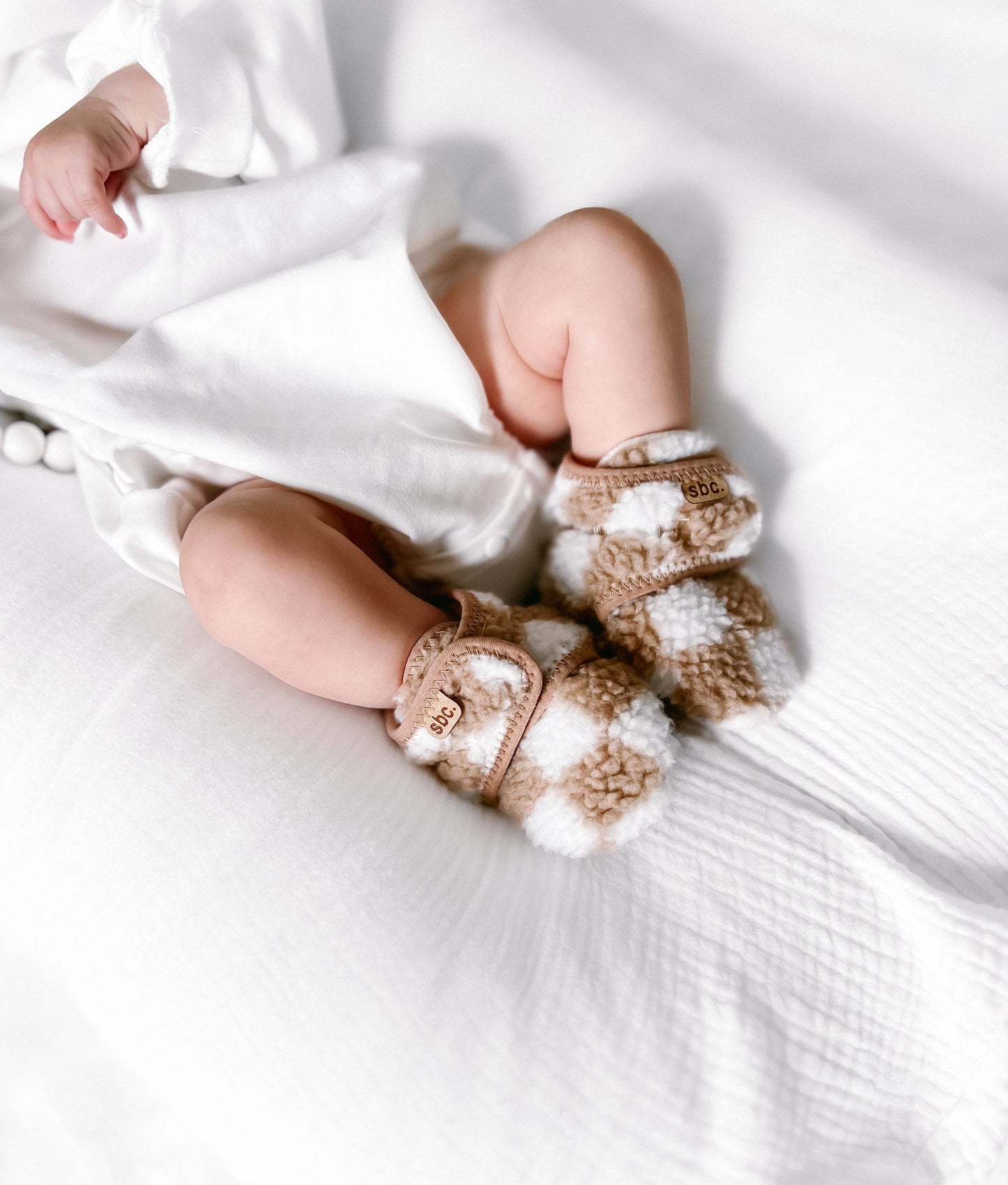 the newborn sherpa bootie — camel + white checkered