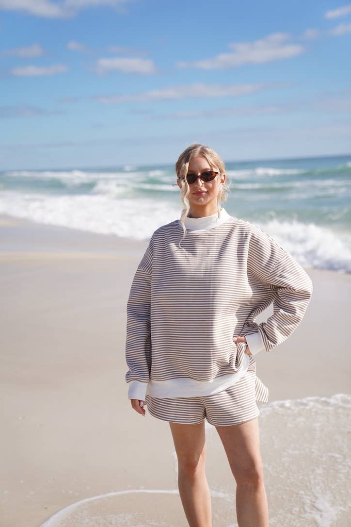 brown + white big striped mockneck sweatshirt