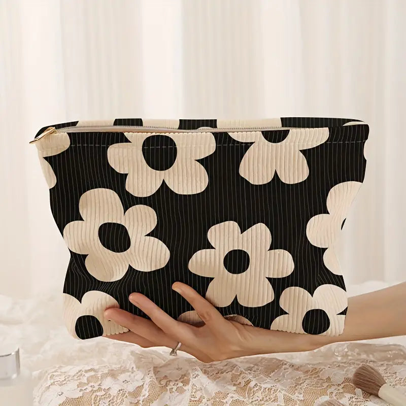 black and white floral corduroy makeup bag with a zipper