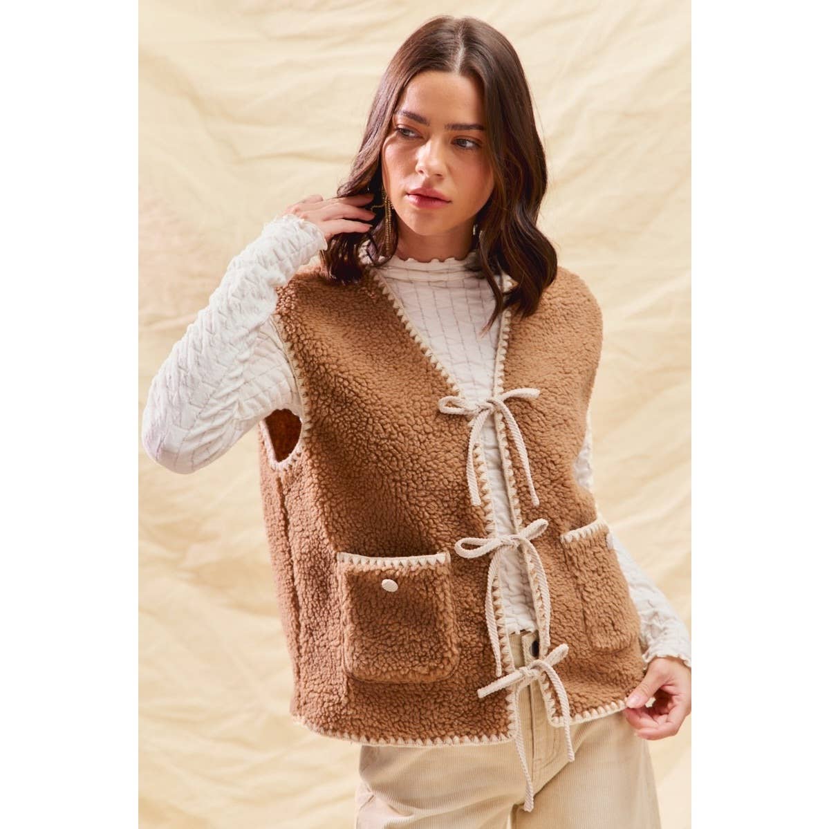 sherpa vest with stitch detail + front pockets