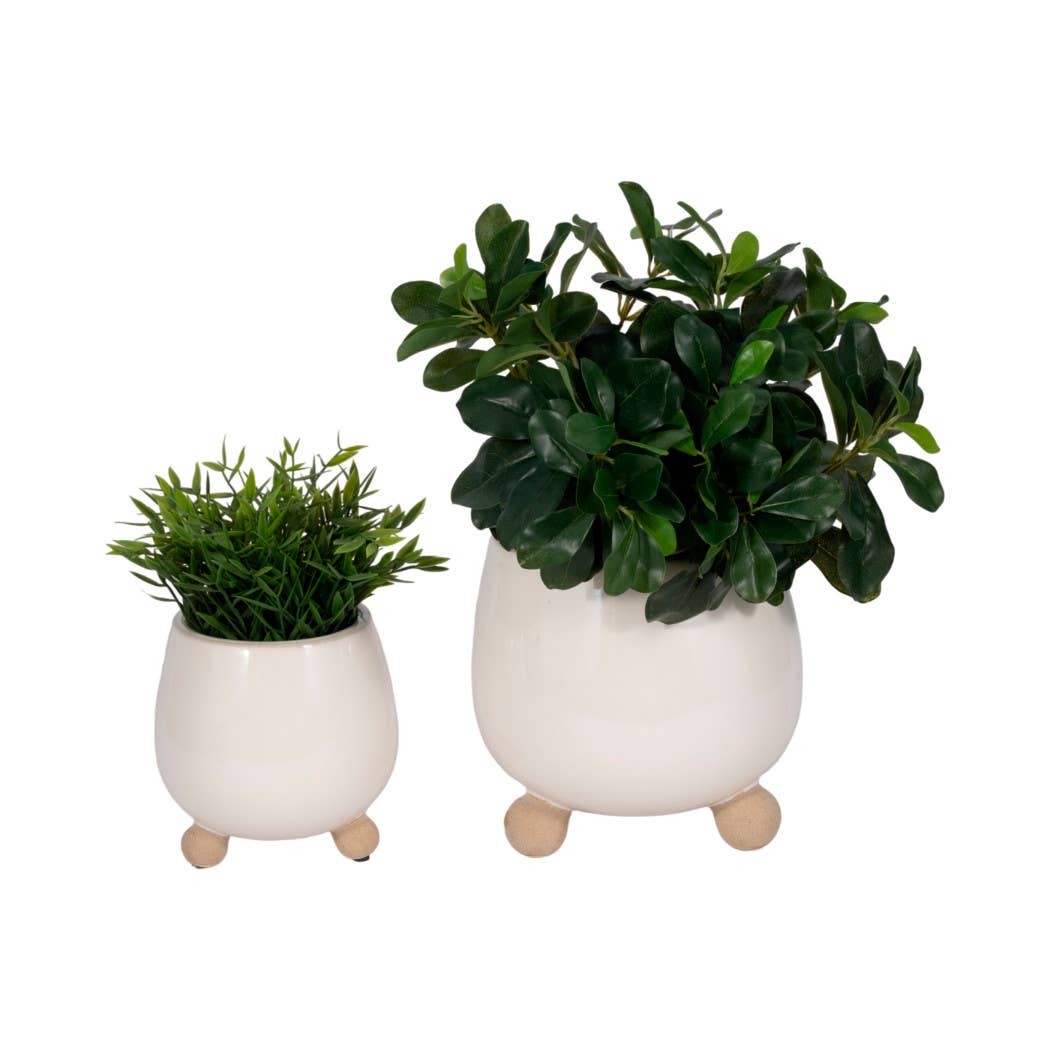 ivory round planter with knobby feet