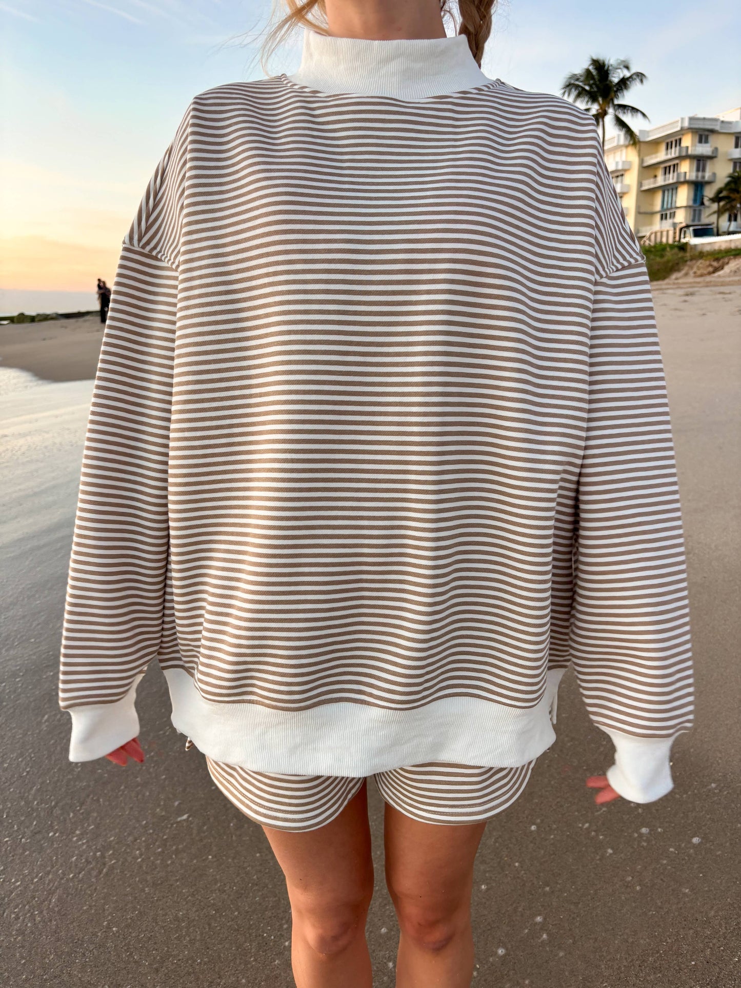 brown + white big striped mockneck sweatshirt