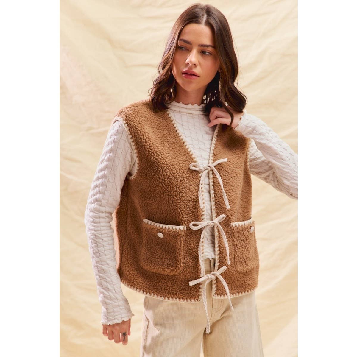 sherpa vest with stitch detail + front pockets