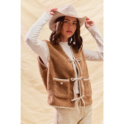 sherpa vest with stitch detail + front pockets