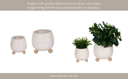 ivory round planter with knobby feet