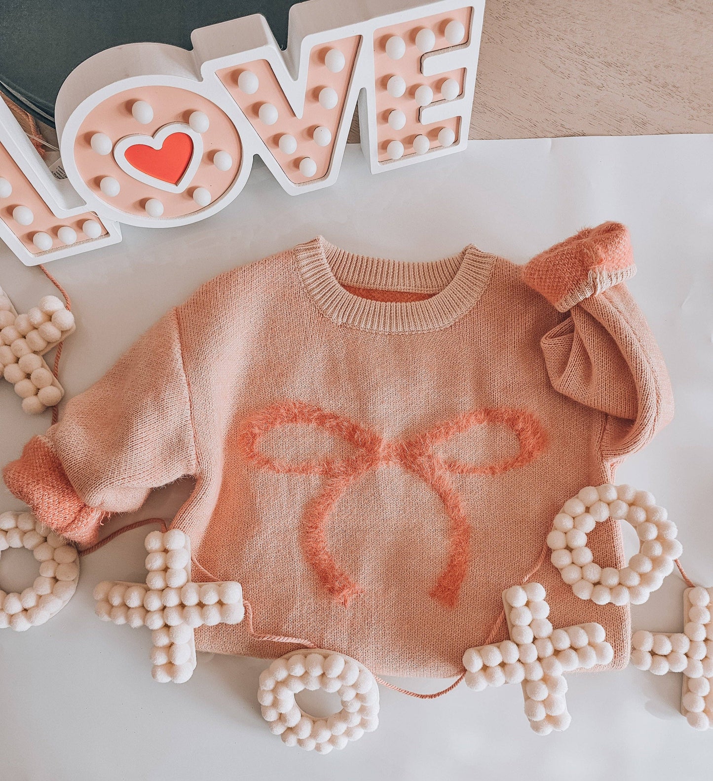 fuzzy bow sweater